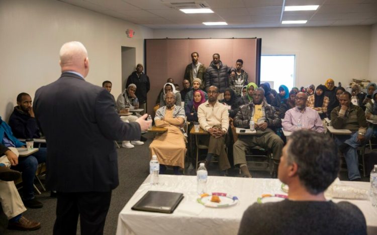 Interim Portland Police Chief Vern Malloch speaks with about 40 people Friday at the Maine Muslim Community Center about the investigation into the shooting death of Isahak Muse. The group asked questions about the case and expressed fears that Muse's killing was a hate crime.