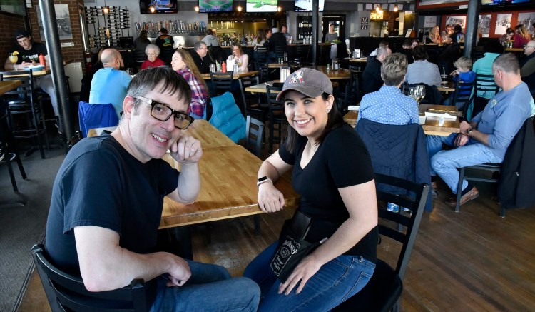 Silver Street Tavern employees Zack Denis and Samantha Clark take a break from serving customers Sunday to talk about the unprecedented $2,000 tip they and other employees will split from an anonymous customer at the Waterville restaurant on Saturday.