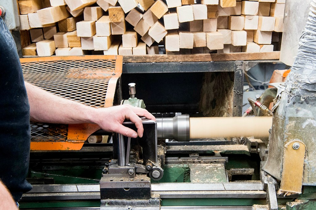 Nick Fletcher, production supervisor at Maine Wood Concepts in New Vineyard, runs the lathe to create wooden Easter eggs on Friday.