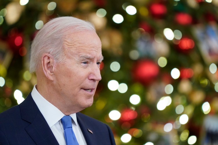President Joe Biden speaks about the COVID-19 response and vaccinations, Tuesday, Dec. 21, 2021, in the State Dining Room of the White House in Washington. (AP Photo/Patrick Semansky)