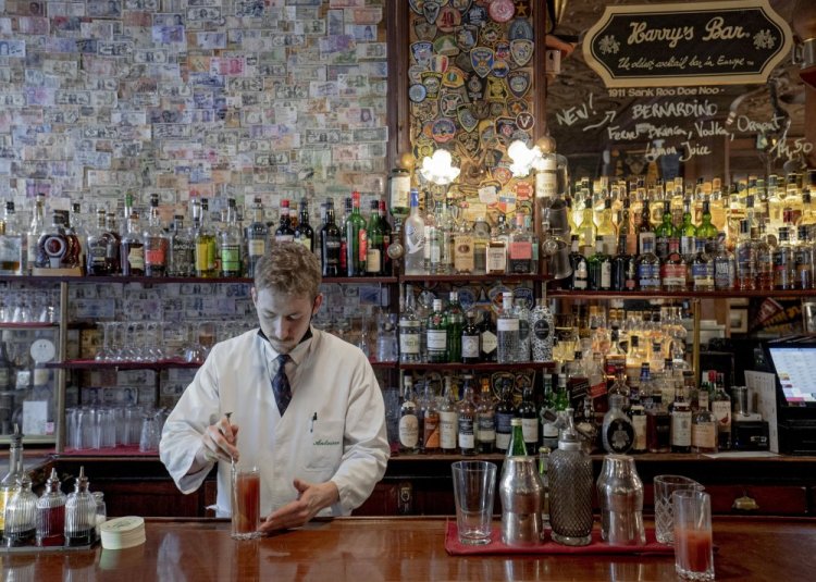 Bartender Antoine prepares a bloody mary at Harry's Bar in Paris on Friday.
