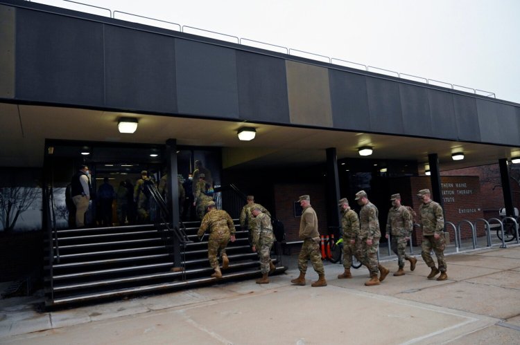 Members of the Maine National Guard arrive at Maine Medical Center for training Thursday. After training, they will be deployed at the hospital assisting clinical teams in non-clinical roles and working in environmental services. 