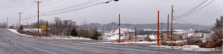 Auburn is proposing to rezone a large section of land that includes a parcel between Gracelawn Road, left, and Lake Auburn, beyond the treeline in the background. City officials said following a study, a watershed boundary has been removed from the land.