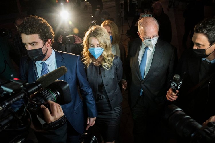 Elizabeth Holmes leaves federal court in San Jose, Calif., after the verdict Monday. Holmes was convicted of fraud for turning her blood-testing startup Theranos into a sophisticated sham that duped investors into backing a seemingly revolutionary company whose medical technology never worked as promised.