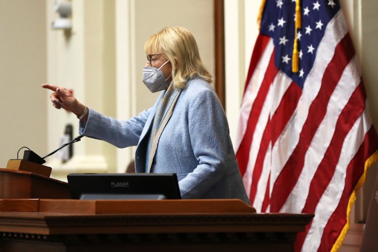 Gov. Janet Mills delivers her State of the State address in the House chamber Thursday night.